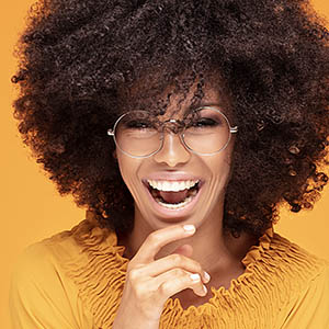 woman smiling for dental payments and insurance services