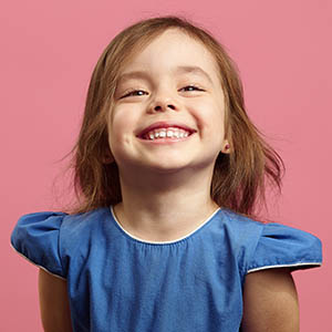 child smiling for pediatric dentistry services