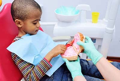 sealants for kids young boy at the dentist receiving sealants for kids