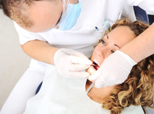 woman getting dental fillings and sealants woodlands tx