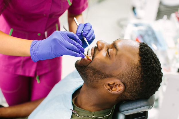 patient receiving dental health services