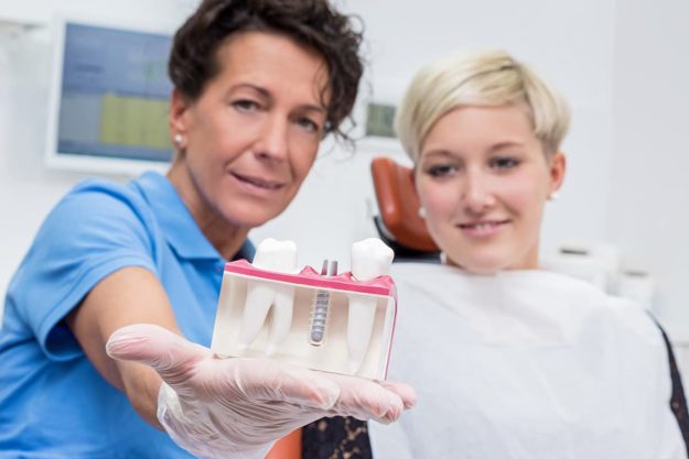 a doctor explaining types of dental implants