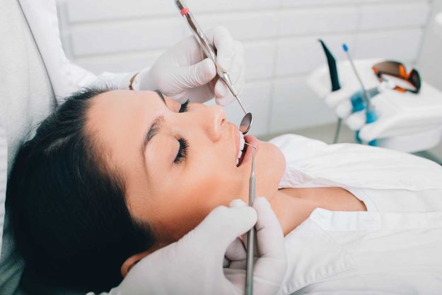 1-3-Benefits-of-Adult-Orthodontic-Services woman gets adult orthodontics services