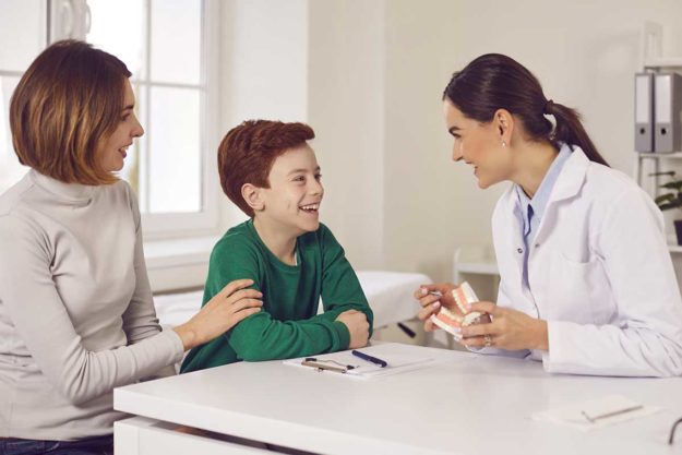 2-How-to-Choose-a-Pediatric-Dental-Office woman chooses a pediatric dentistry office