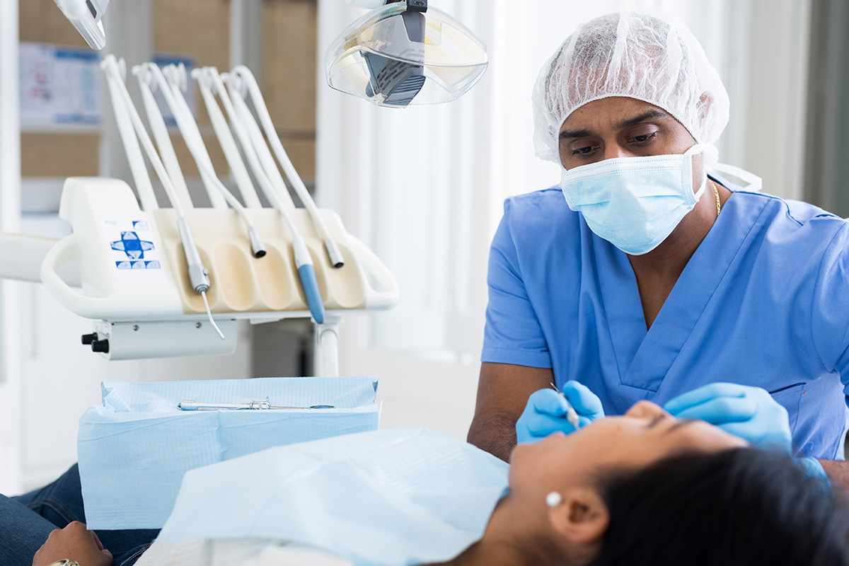 4 Common Types of Oral Surgeries (6) dentist explaining different oral surgeries